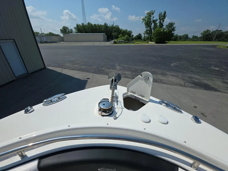 Slide: The Image of 2021 Robalo R242 Center Console boat deck with anchor, outdoors. - 23