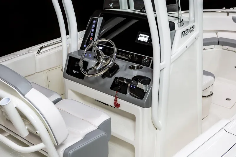 Slide: The Image of Manufacturer Provided Image: 2021 Robalo R242 Center Console boat interior with steering wheel and seating. - 29