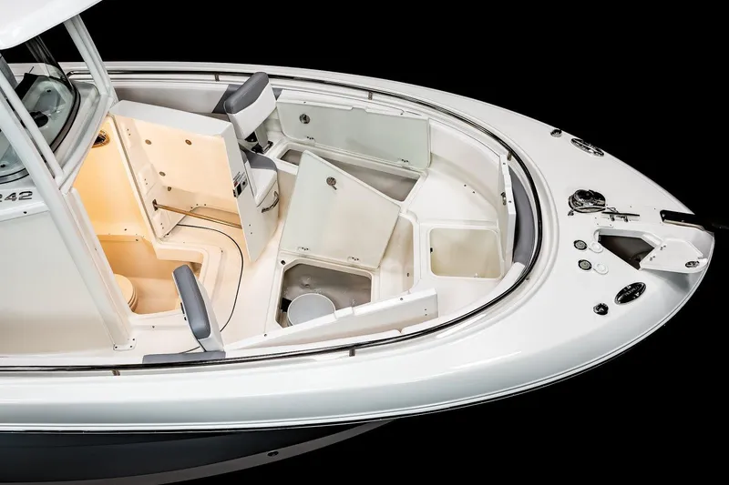 Slide: The Image of Manufacturer Provided Image: 2021 Robalo R242 Center Console boat interior with storage compartments and seating. - 30