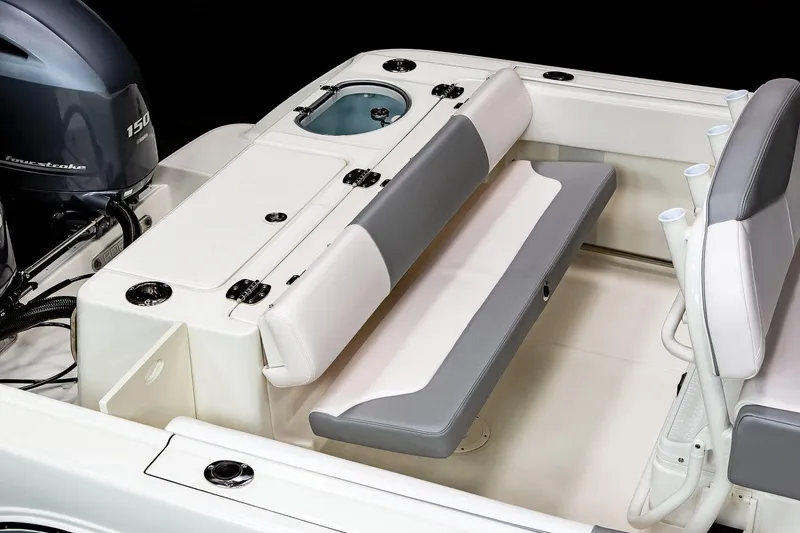 Slide: The Image of Manufacturer Provided Image: 2021 Robalo R242 Center Console boat interior with seating and engine. - 32