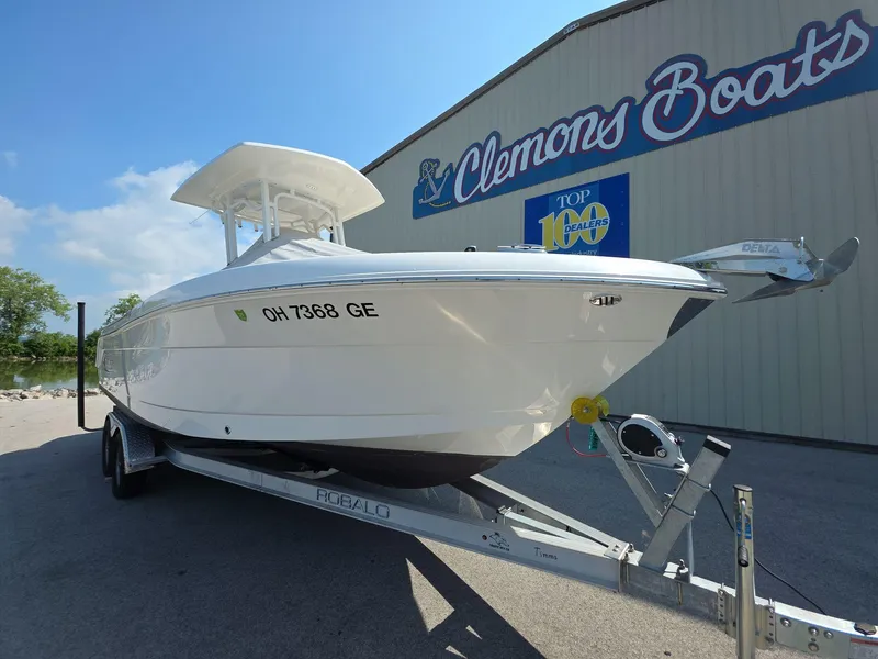 Slide: The Image of 2021 Robalo R242 Center Console boat on trailer at Clemons Boats dealership. - 5