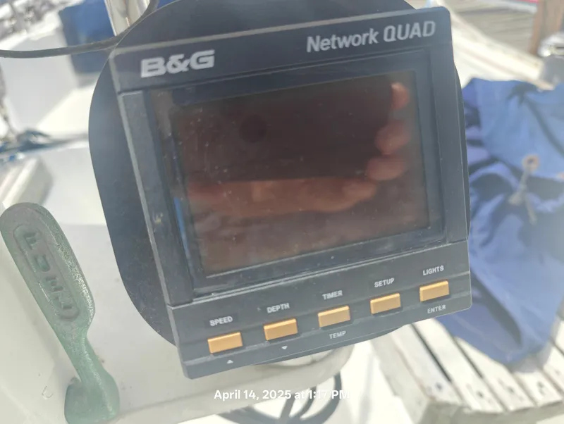 Slide: The Image of B&G Network QUAD display on 1984 Hunter 40 sailboat, showing control buttons. - 14
