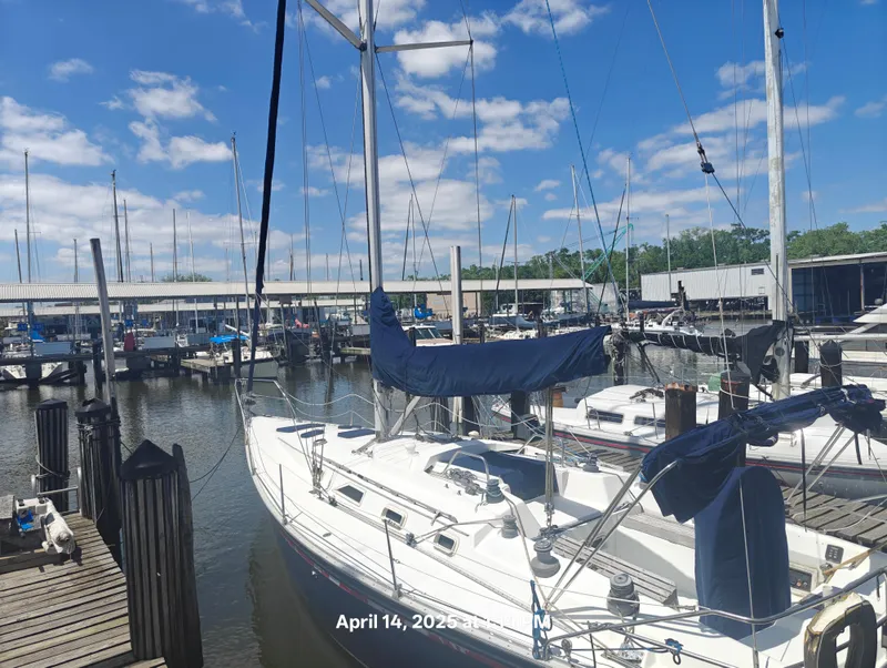 Slide: The Image of Sailboat docked at marina under blue sky, Hunter 40 model, 1984. - 2
