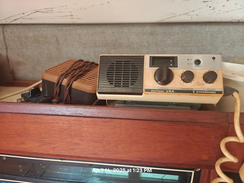 Slide: The Image of Vintage radio equipment on a Hunter 40, 1984 model, with wood paneling. - 26