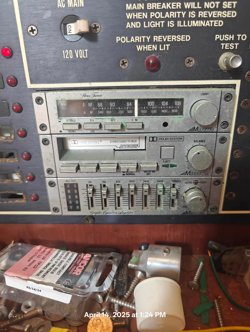 Slide: The Image of Vintage Hunter 40 control panel with stereo system and switches, dated April 14, 2025. - 28