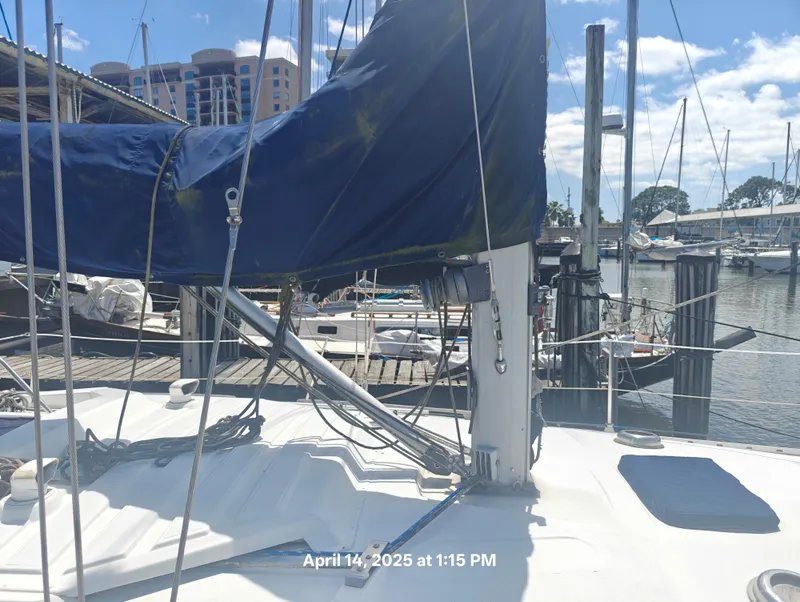 Slide: The Image of Sailboat docked at marina, Hunter 40 model, 1984, with blue sail cover. - 5