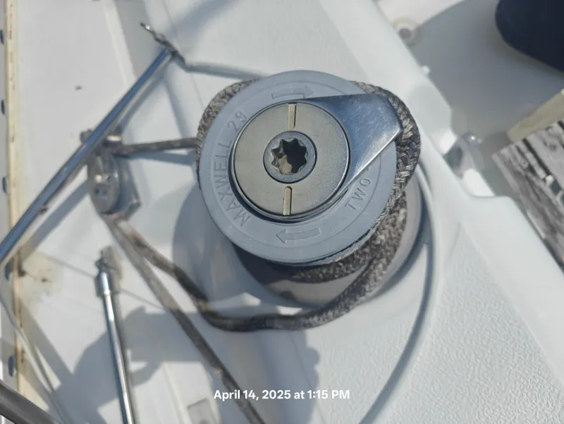 Slide: The Image of Winch on 1984 Hunter 40 sailboat deck, labeled "Maxwell 29." - 7