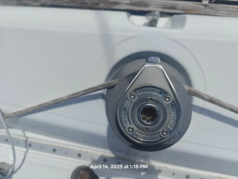 Slide: The Image of Close-up of a winch on a 1984 Hunter 40 sailboat, with rope attached. - 8