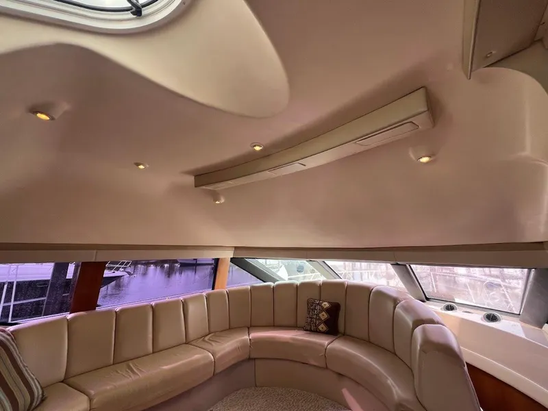 Slide: The Image of Luxurious interior of 2006 Carver 56 Voyager yacht with plush seating and elegant design. - 16