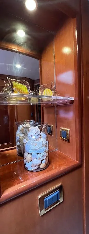 Slide: The Image of Luxurious interior of 2006 Carver 56 Voyager yacht with elegant wooden cabinetry and decorative accents. - 19