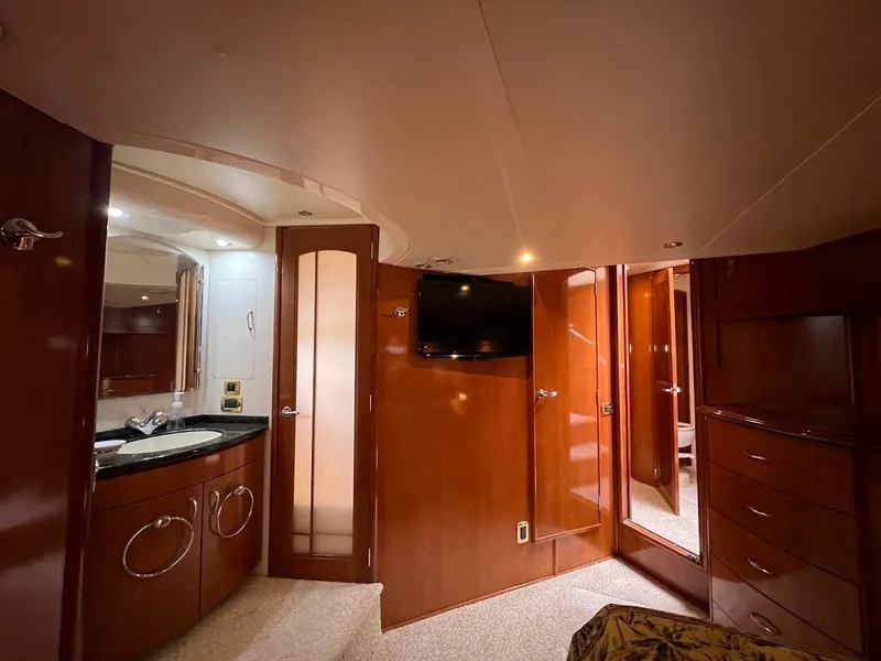 Slide: The Image of Luxurious interior of 2006 Carver 56 Voyager yacht with wood finish and modern amenities. - 24