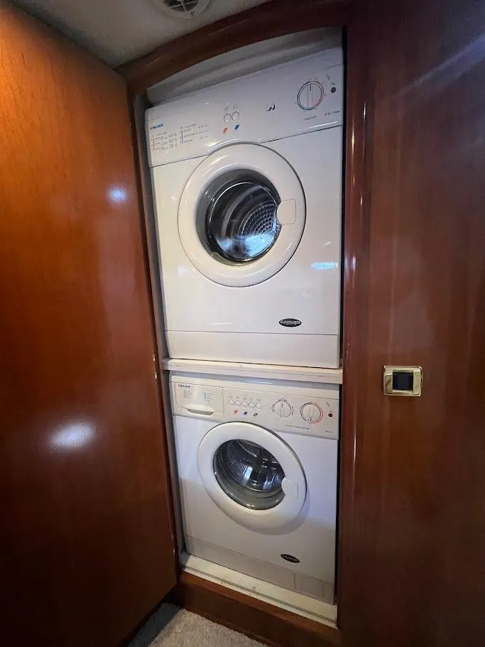 Slide: The Image of Stacked washer and dryer in 2006 Carver 56 Voyager yacht interior. - 25