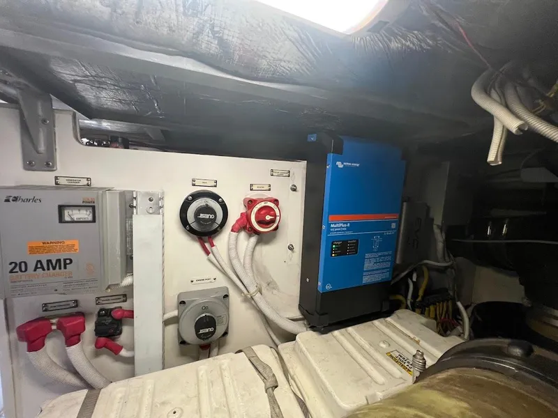 Slide: The Image of Electrical system inside 2006 Carver 56 Voyager yacht, featuring battery charger and inverter. - 47