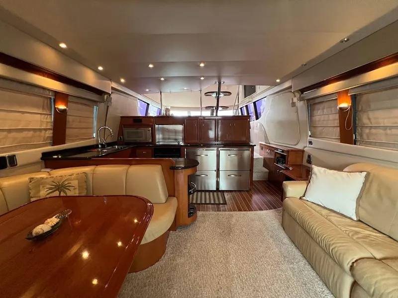 Slide: The Image of Luxurious interior of a 2006 Carver 56 Voyager yacht with elegant furnishings and modern amenities. - 5