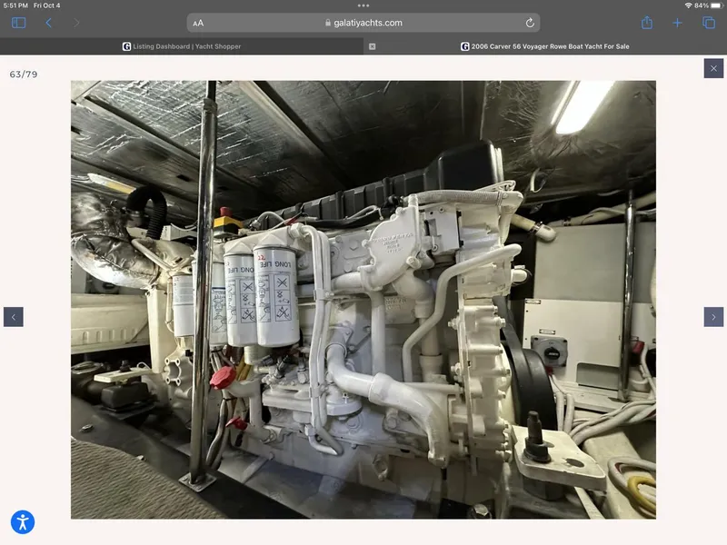 Slide: The Image of Engine room of 2006 Carver 56 Voyager yacht, showcasing mechanical components. - 52