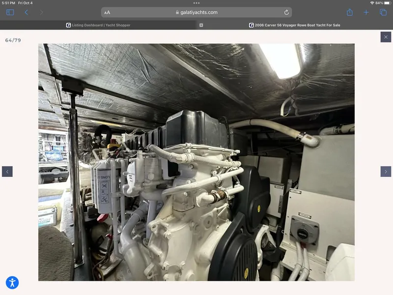 Slide: The Image of Engine room of 2006 Carver 56 Voyager yacht, showcasing mechanical components and piping. - 53