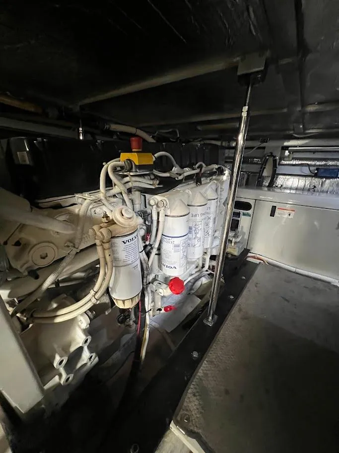Slide: The Image of Engine room of 2006 Carver 56 Voyager yacht, featuring Volvo components. - 54