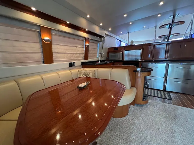 Slide: The Image of Luxurious interior of 2006 Carver 56 Voyager yacht with elegant dining and kitchen area. - 8