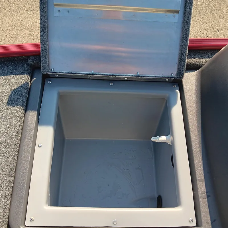 Slide: The Image of Open storage compartment in 2026 Tracker Bass Tracker Classic XL boat. - 8
