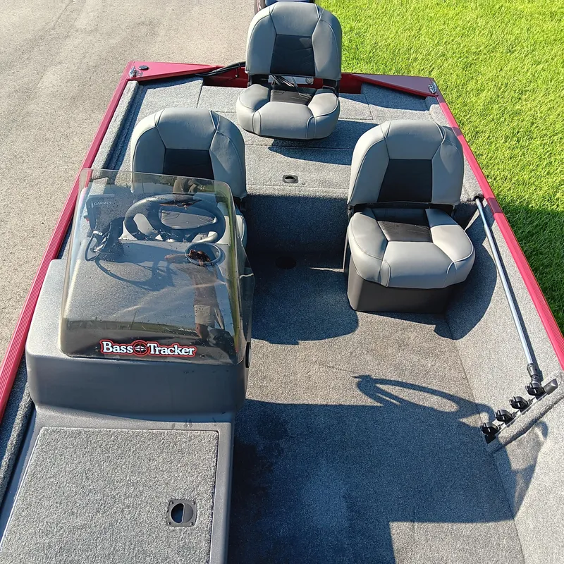 Slide: The Image of 2026 Tracker Bass Tracker Classic XL boat interior with seating and steering console. - 9