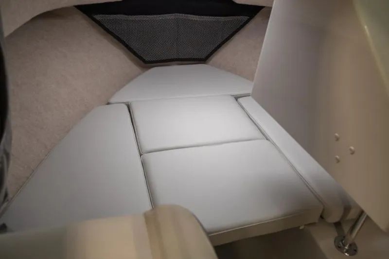 Slide: The Image of Manufacturer Provided Image: 2023 Parker 2120 Sport Cabin interior with cushioned seating and storage. - 1