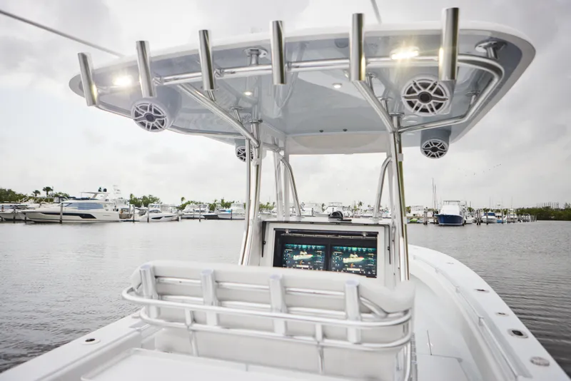 Slide: The Image of 2026 Contender 32 ST boat with advanced navigation system at marina. - 14
