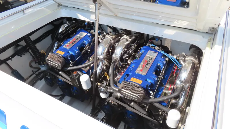 Slide: The Image of Twin engines in a 2000 Formula Fastech boat, showcasing powerful performance and engineering. - 10