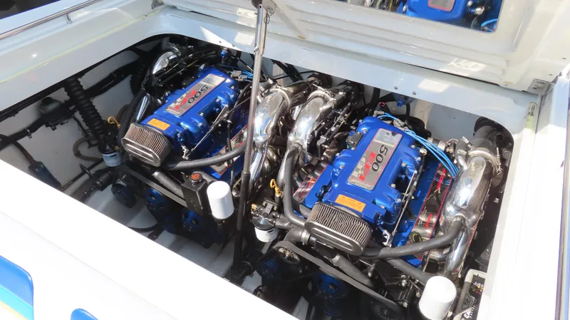 Slide: The Image of 2000 Formula Fastech boat engine compartment with twin blue high-performance engines. - 11