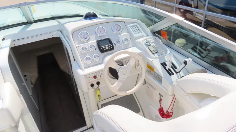 Slide: The Image of Cockpit of 2000 Formula Fastech boat with white interior and control panel. - 15