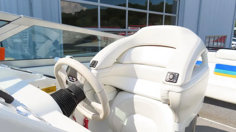 Slide: The Image of Interior of a 2000 Formula Fastech boat with white leather seating. - 16