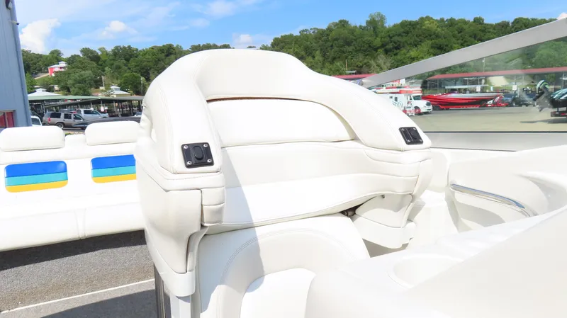 Slide: The Image of White leather seating on a 2000 Formula Fastech boat, with colorful accents and scenic background. - 17