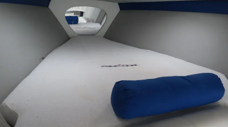 Slide: The Image of Interior cabin of a 2000 Formula Fastech boat with blue cushions. - 19