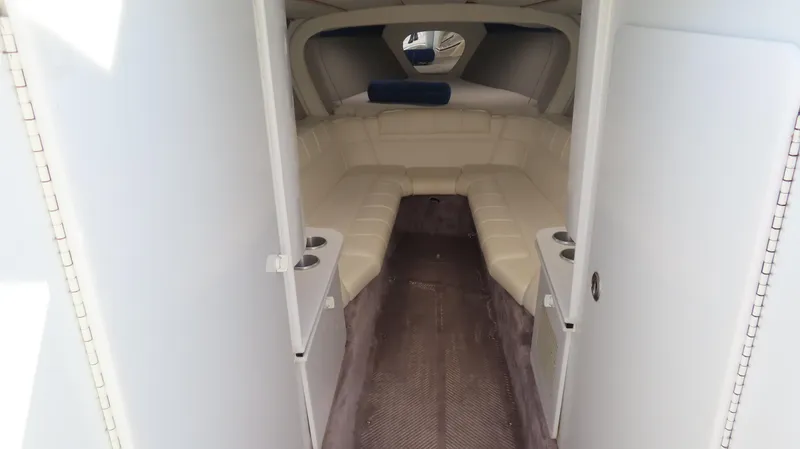 Slide: The Image of Interior of a 2000 Formula Fastech boat with beige seating and modern design. - 24