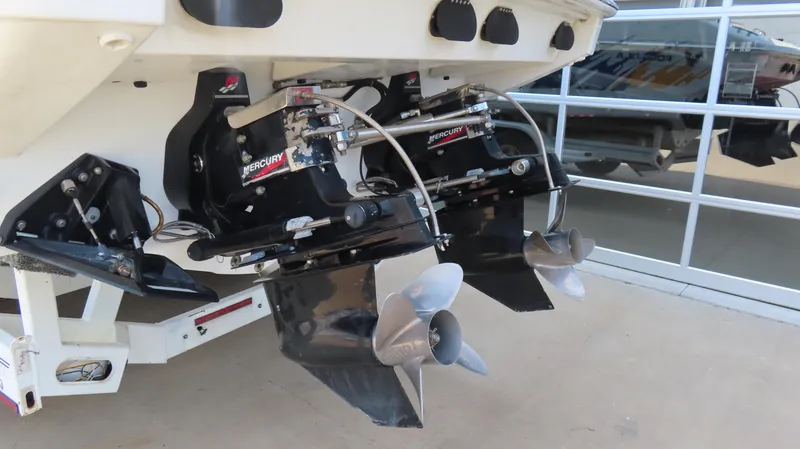 Slide: The Image of Dual Mercury outboard motors on a 2000 Formula Fastech boat, showcasing propellers. - 28