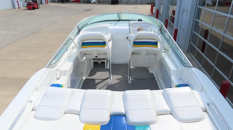 Slide: The Image of 2000 Formula Fastech boat interior with white seating and colorful accents. - 6