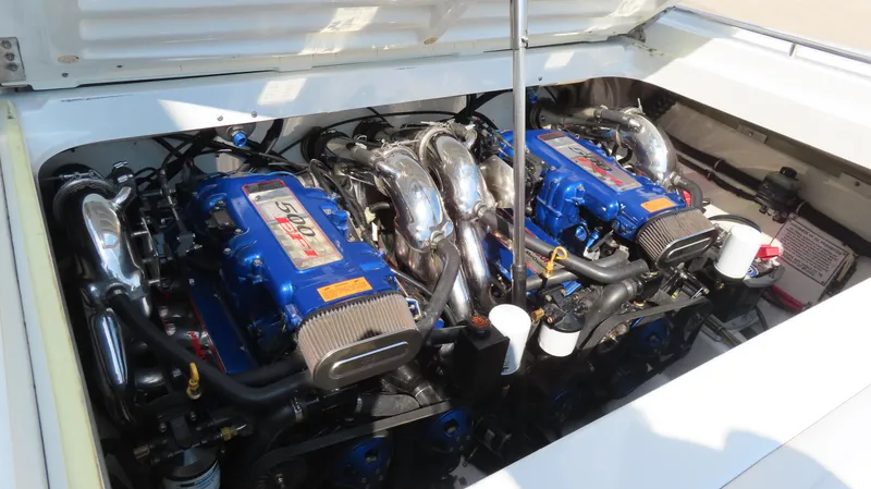 Slide: The Image of Twin blue engines in a 2000 Formula Fastech boat, showcasing high-performance power. - 9