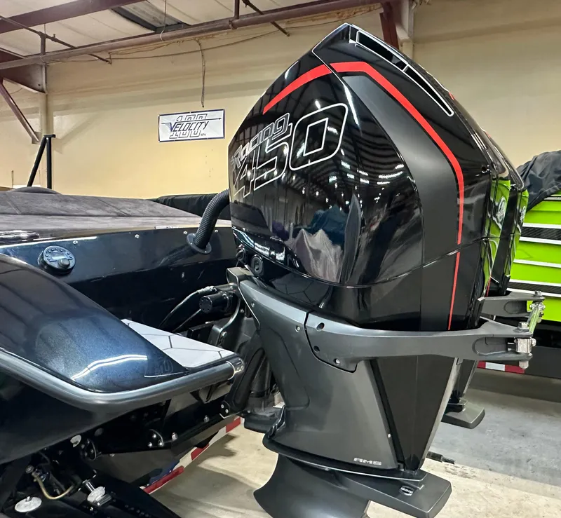 Slide: The Image of 2022 Velocity VR1 boat with powerful Racing 450 engine in a garage setting. - 11