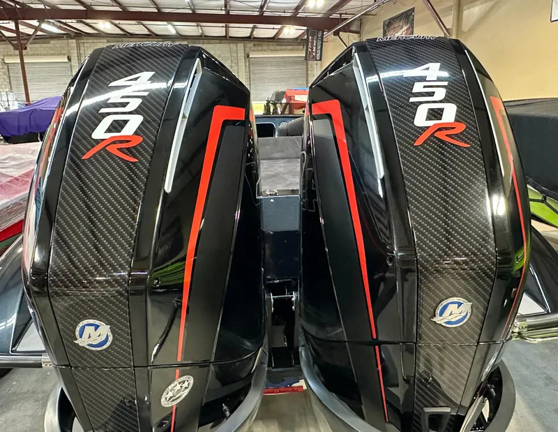 Slide: The Image of Twin Mercury 450R outboard engines on a 2022 Velocity VR1 boat, featuring sleek black design. - 12