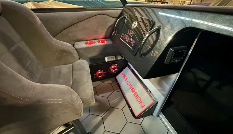 Slide: The Image of Interior of 2022 Velocity VR1 with VR1 Carbon branding and illuminated cup holders. - 17