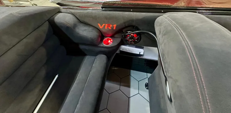 Slide: The Image of Interior of 2022 Velocity VR1 with plush seating and red accent lighting. - 18
