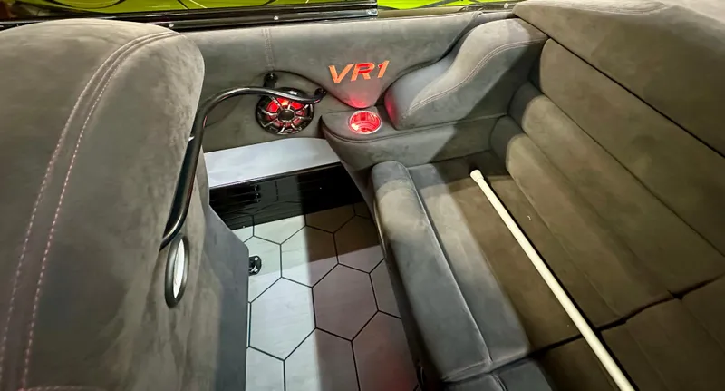 Slide: The Image of 2022 Velocity VR1 interior with plush seating, VR1 logo, and modern speaker system. - 19