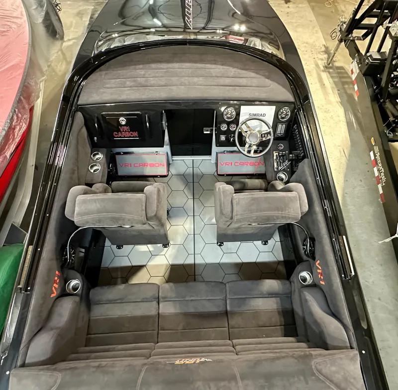 Slide: The Image of 2022 Velocity VR1 boat interior with gray seating, hexagonal flooring, and modern dashboard. - 24