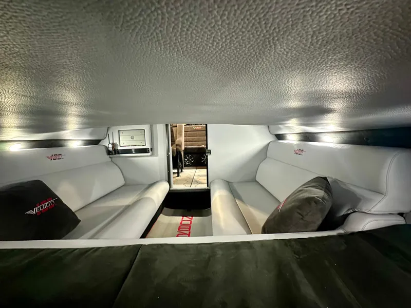 Slide: The Image of Interior of 2022 Velocity VR1 boat with white seating and branded cushions. - 30