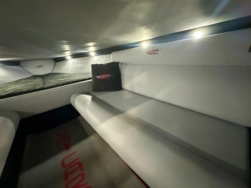 Slide: The Image of Interior of 2022 Velocity VR1 boat with cushioned seating and ambient lighting. - 31