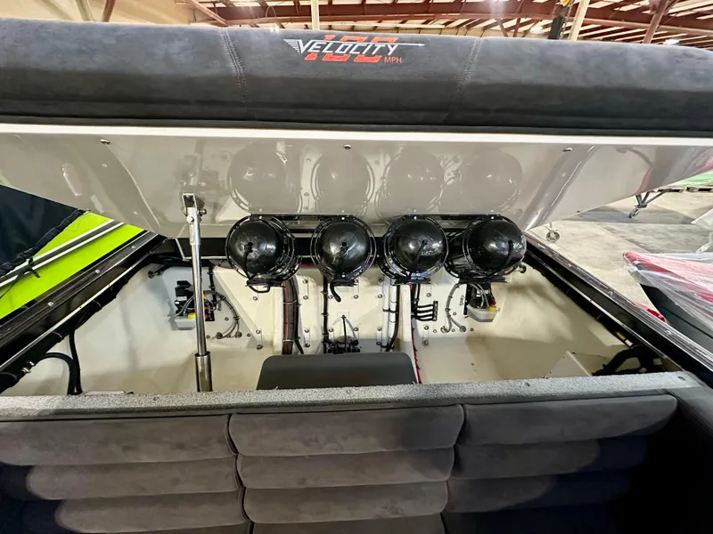 Slide: The Image of 2022 Velocity VR1 boat engine compartment with four powerful engines, open hatch view. - 33