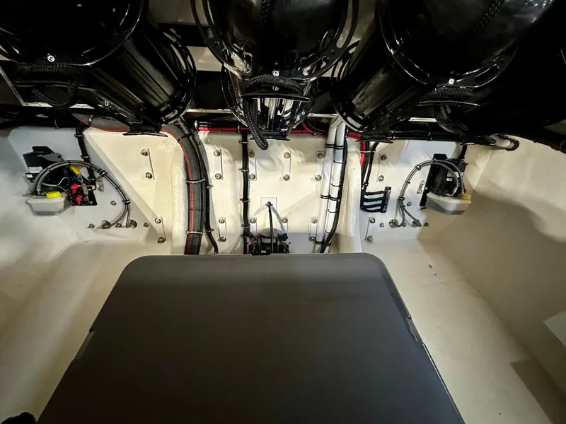 Slide: The Image of Engine compartment of a 2022 Velocity VR1 boat, showcasing wiring and components. - 34