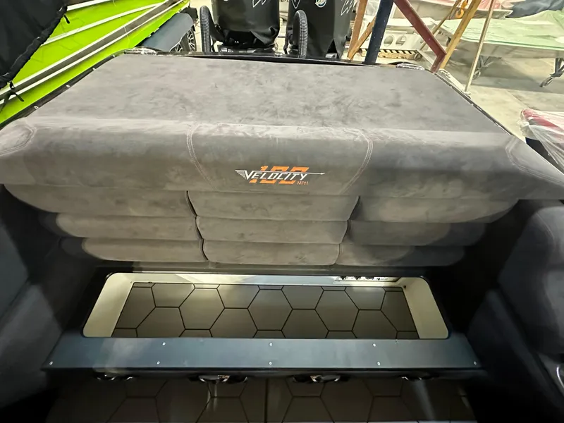 Slide: The Image of 2022 Velocity VR1 boat interior with cushioned seating and hexagonal floor design. - 35