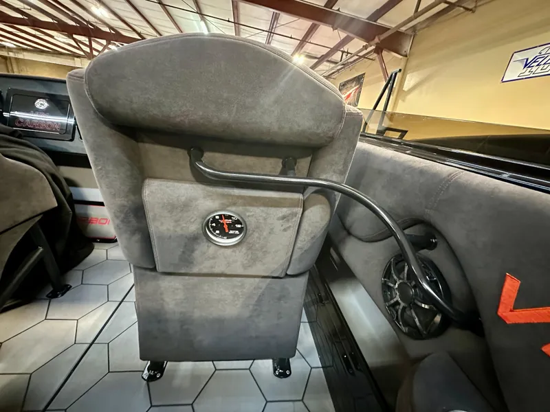 Slide: The Image of Interior of a 2022 Velocity VR1 boat, featuring a gauge and speaker. - 36