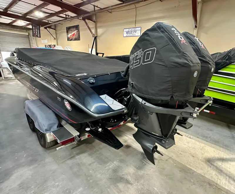 Slide: The Image of 2022 Velocity VR1 boat with twin 450R engines in a garage setting. - 8