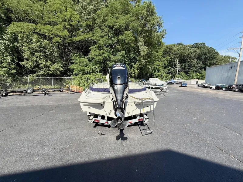 Slide: The Image of 2016 Boston Whaler 210 Dauntless boat with outboard motor in a parking lot. - 4
